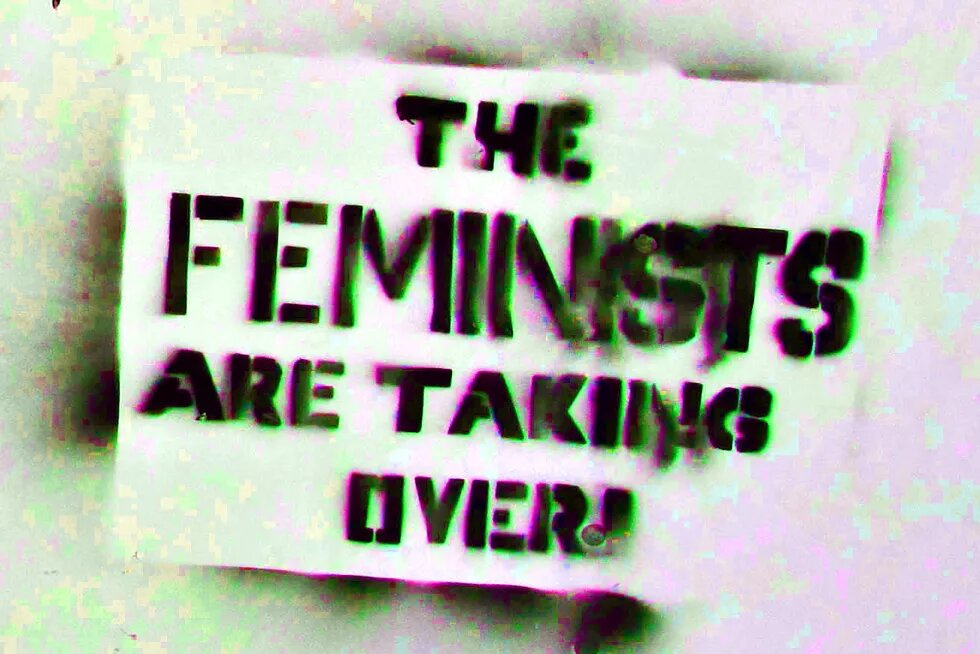 "Feminists are taking over" sprayed on a utility box